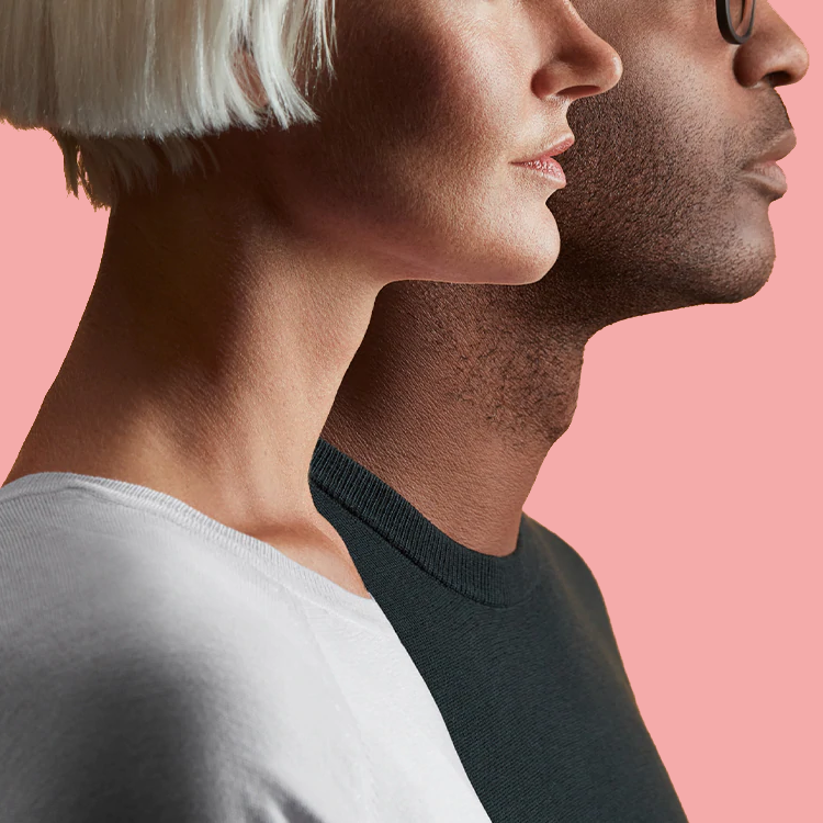 Upper body profiles of man and woman in black and white shirts with peach background.