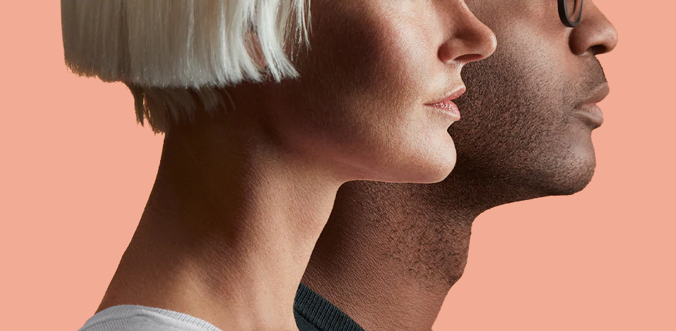 Profile headshot of man and woman against peach background.